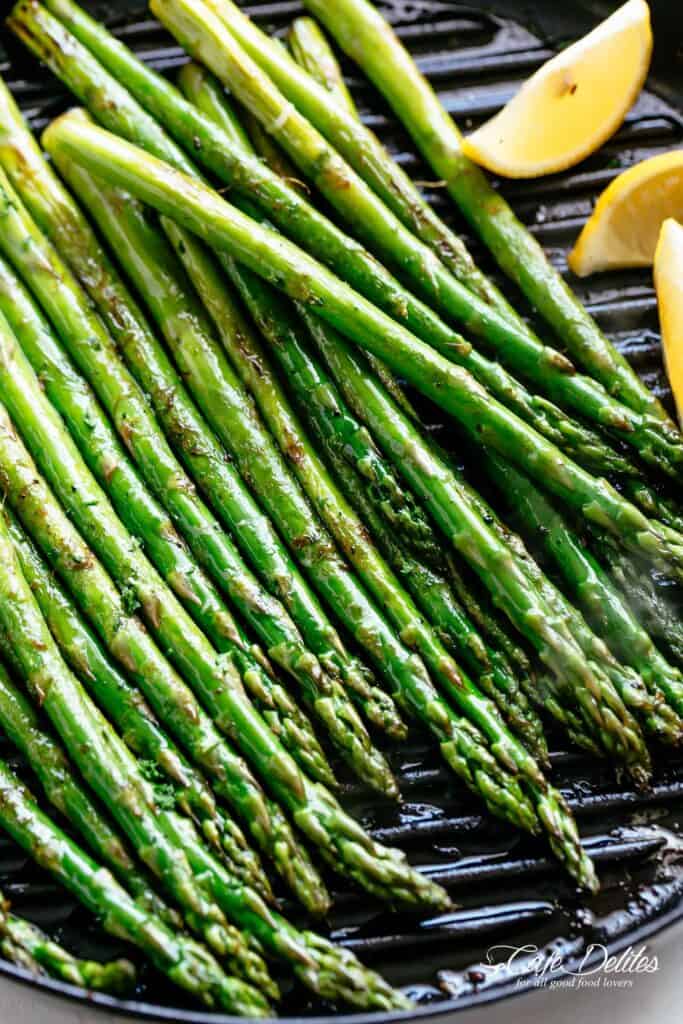 Grilled Asparagus is a simple toss in olive oil and garlic, season with salt and pepper and throw them directly on the grill!