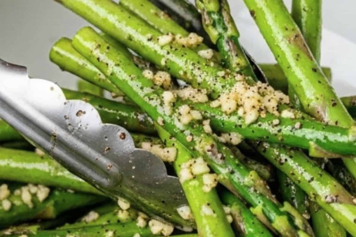 Toss with olive oil, minced garlic, salt and cracked pepper until every spear is evenly coated - 4