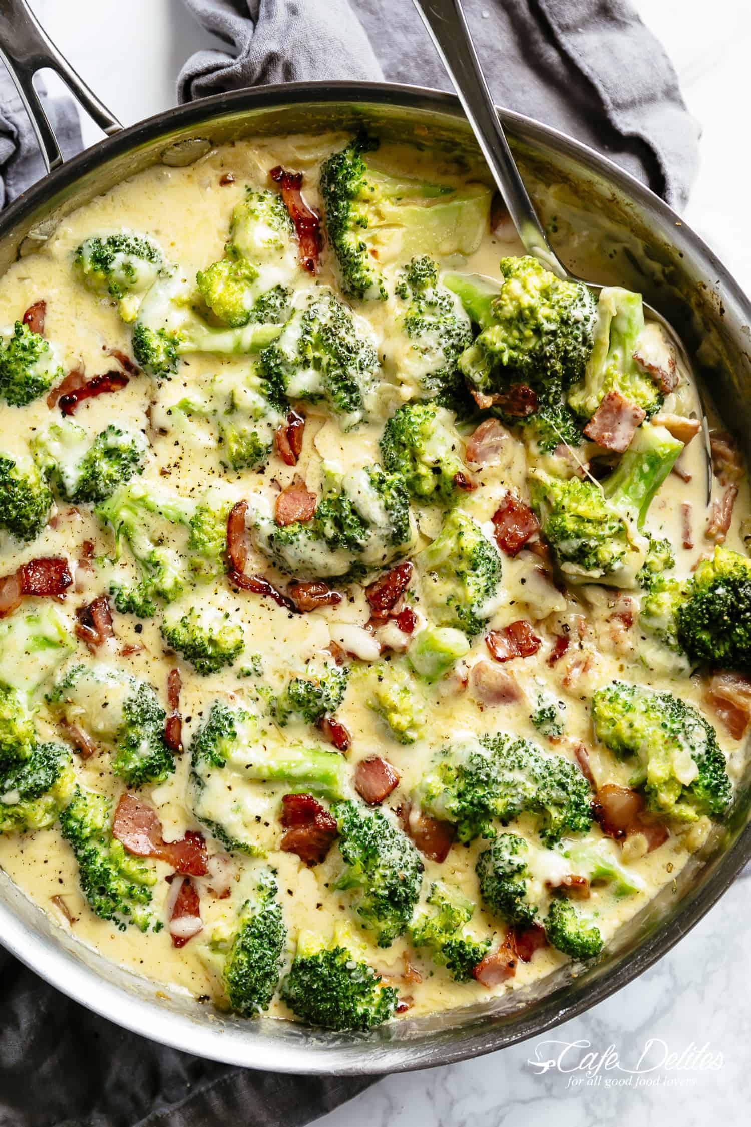 Broccoli Casserole baked in a cheesy creamy parmesan garlic sauce topped with bubbling mozzarella! Keto approved and low carb! | cafedelites.com