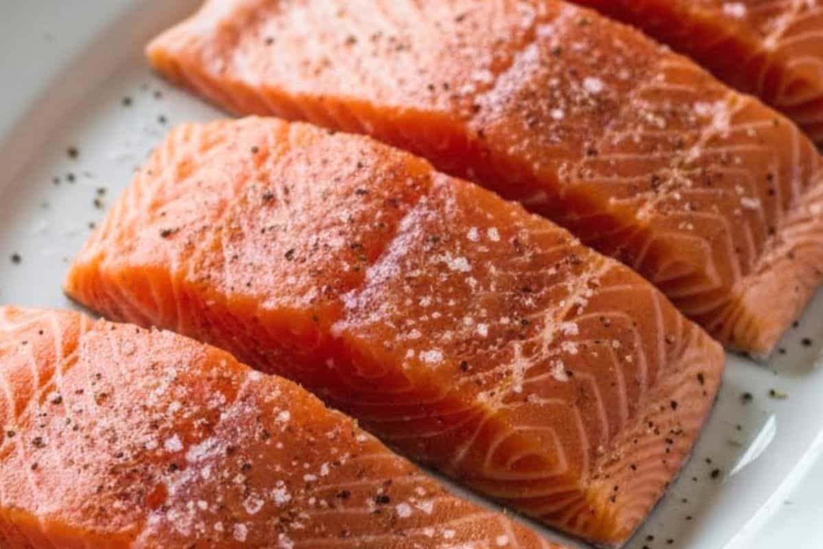 Pat the salmon fillets dry, then season both sides evenly with salt and pepper.