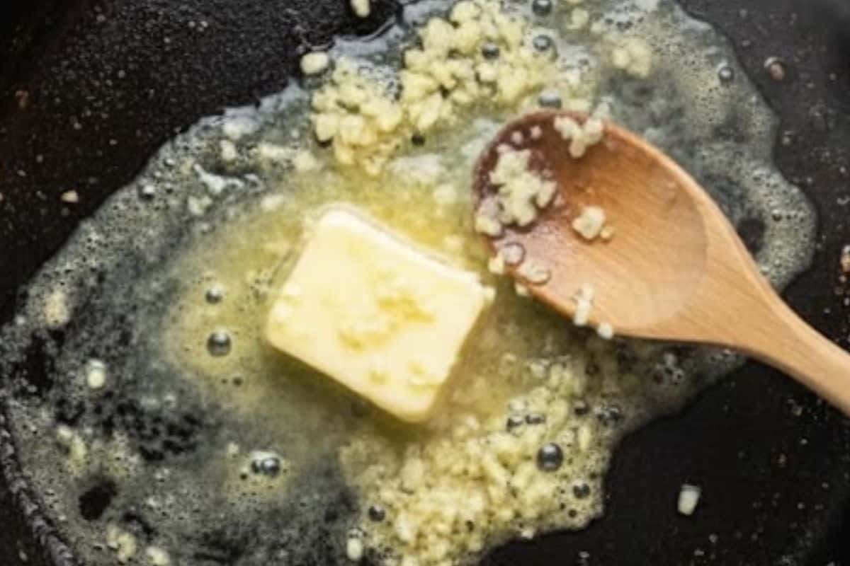 Add the remaining butter to the skillet and let it melt. Stir in the minced garlic and cook until fragrant.