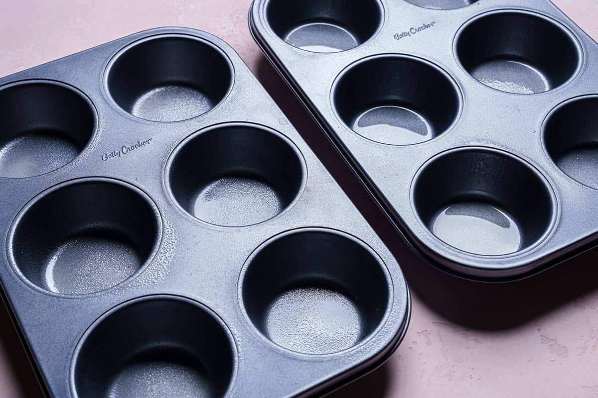 Image of muffin tins ready to be filled with egg mixture.