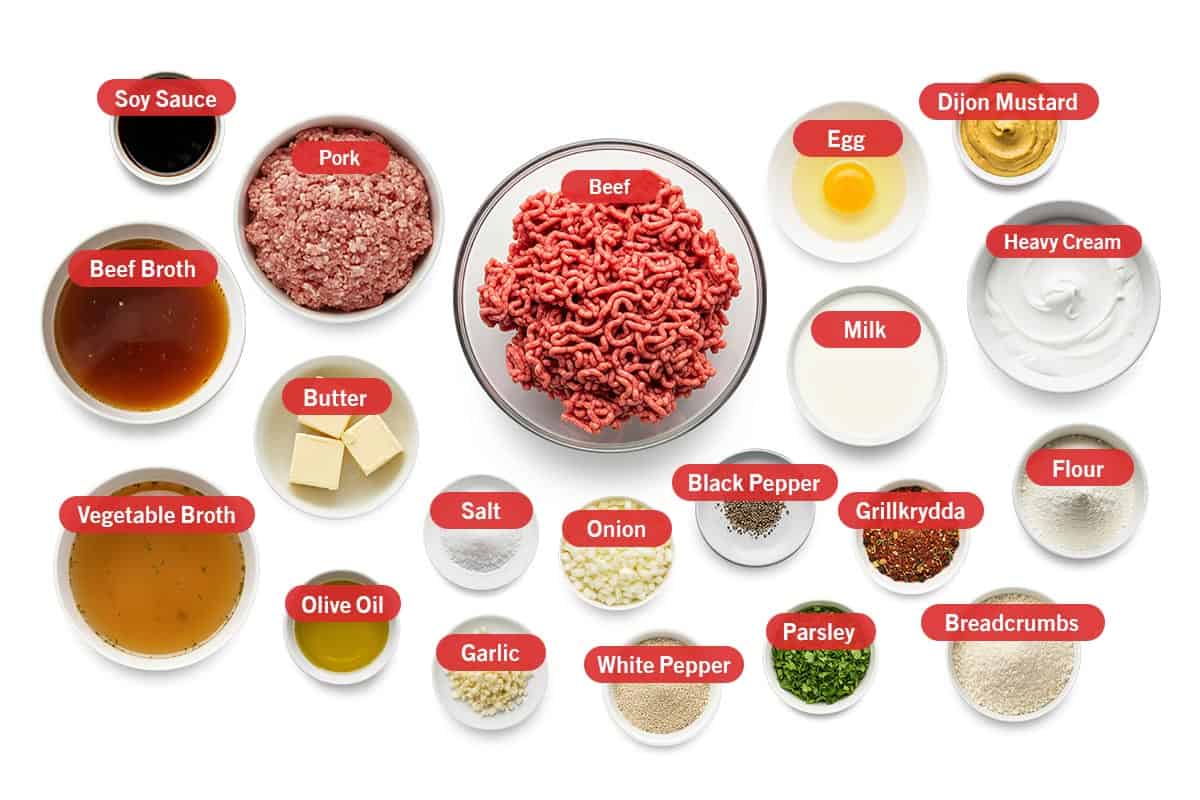 Top shot of ingredients: soy sauce, pork, beef, egg, dijon mustard, beef broth, butter, vegetable broth, olive oil, salt, garlic, onion, white pepper, black pepper, parsley, milk, grillkrydda, heavy cream, flour, and breadcrumbs.