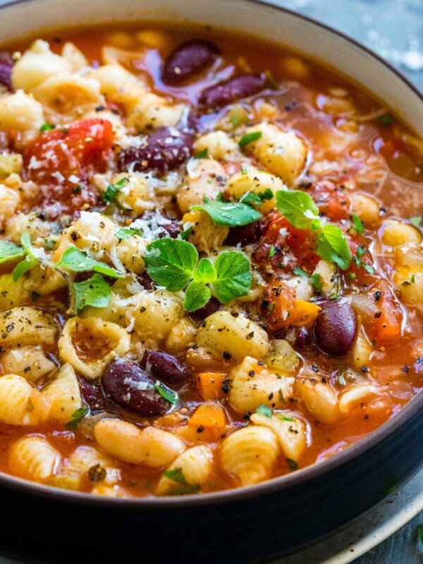 Bowl of Pasta e Fagioli topped with garnish in a bowl
