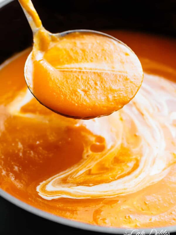 Naturally thick and creamy Butternut Squash Soup , in a ladle