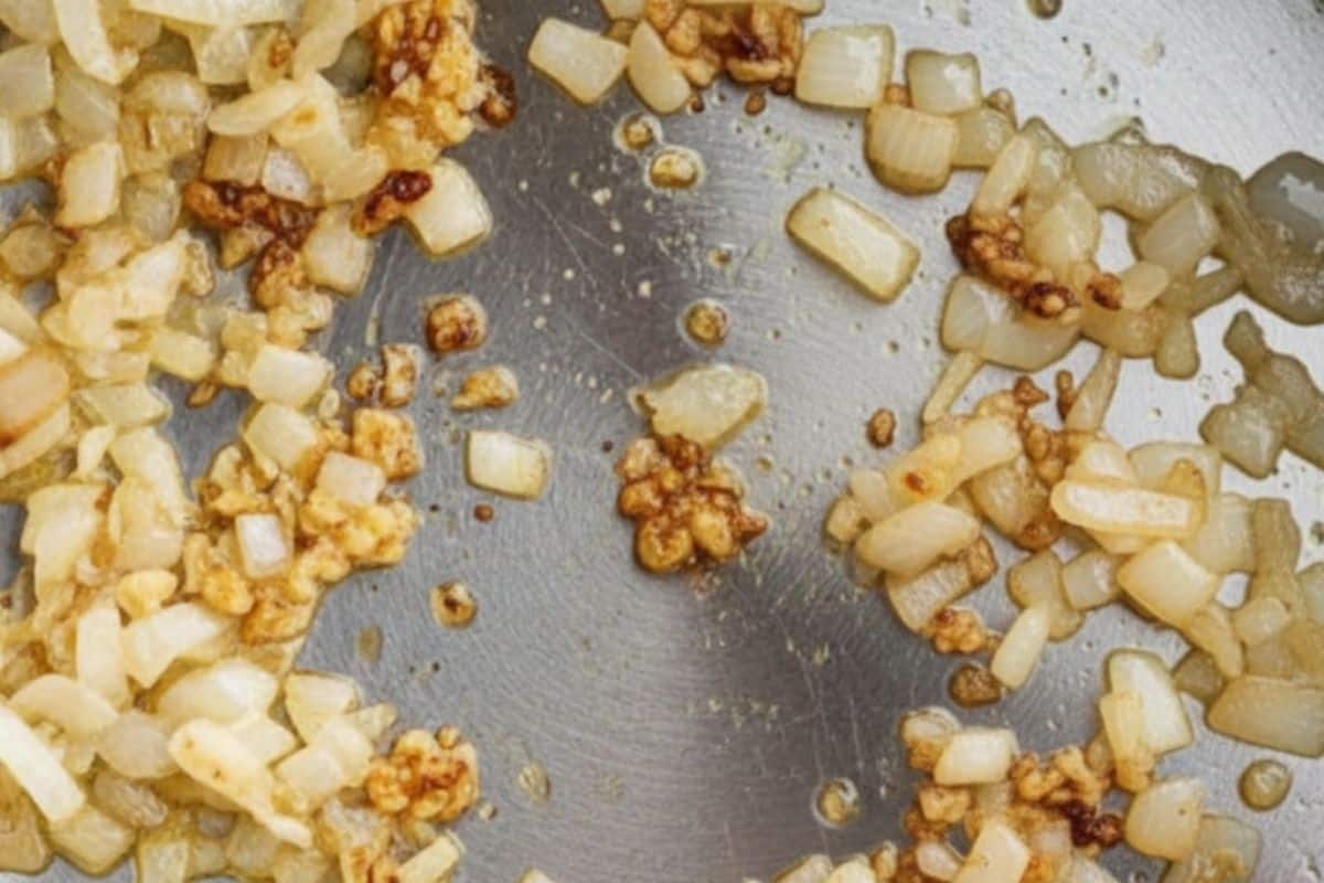 In a medium high heat, cook garlic and onions.