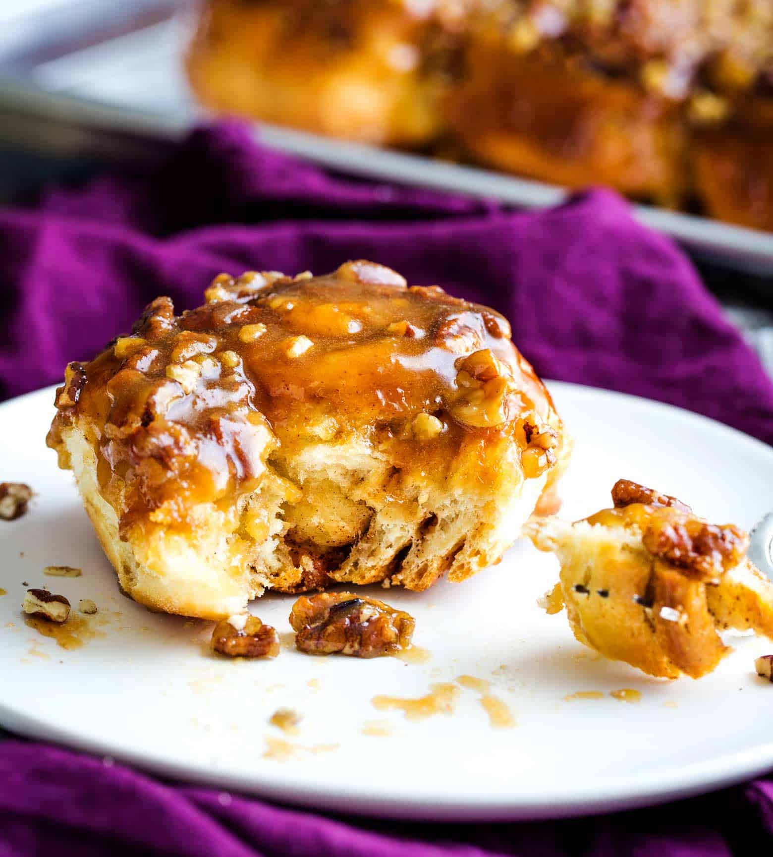 These maple pecan sticky buns perfect a cold morning or for a holiday breakfast. Soft, sweet and sticky, these buns are so much fun to make! | cafedelites.com