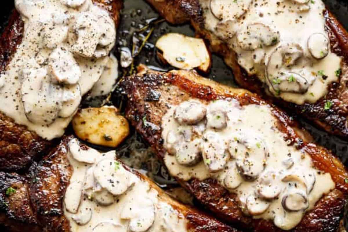 Close-up shot of Pan Seared Garlic Butter Steak & Mushroom Cream Sauce.
