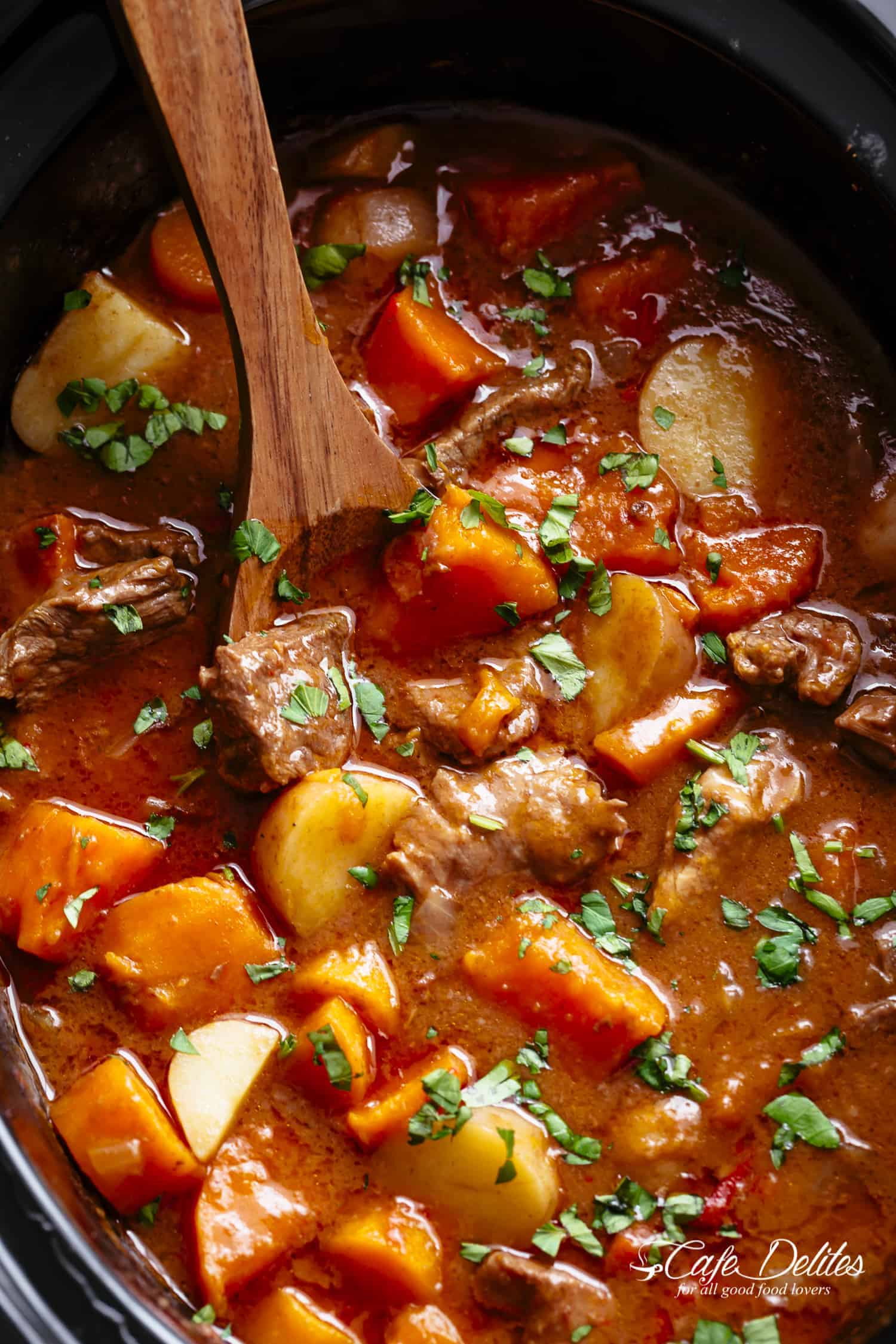 Slow Cooker Beef Stew is easy to throw together and filled with fall apart, tender beef pieces and sweet potato! | https://cafedelites.com