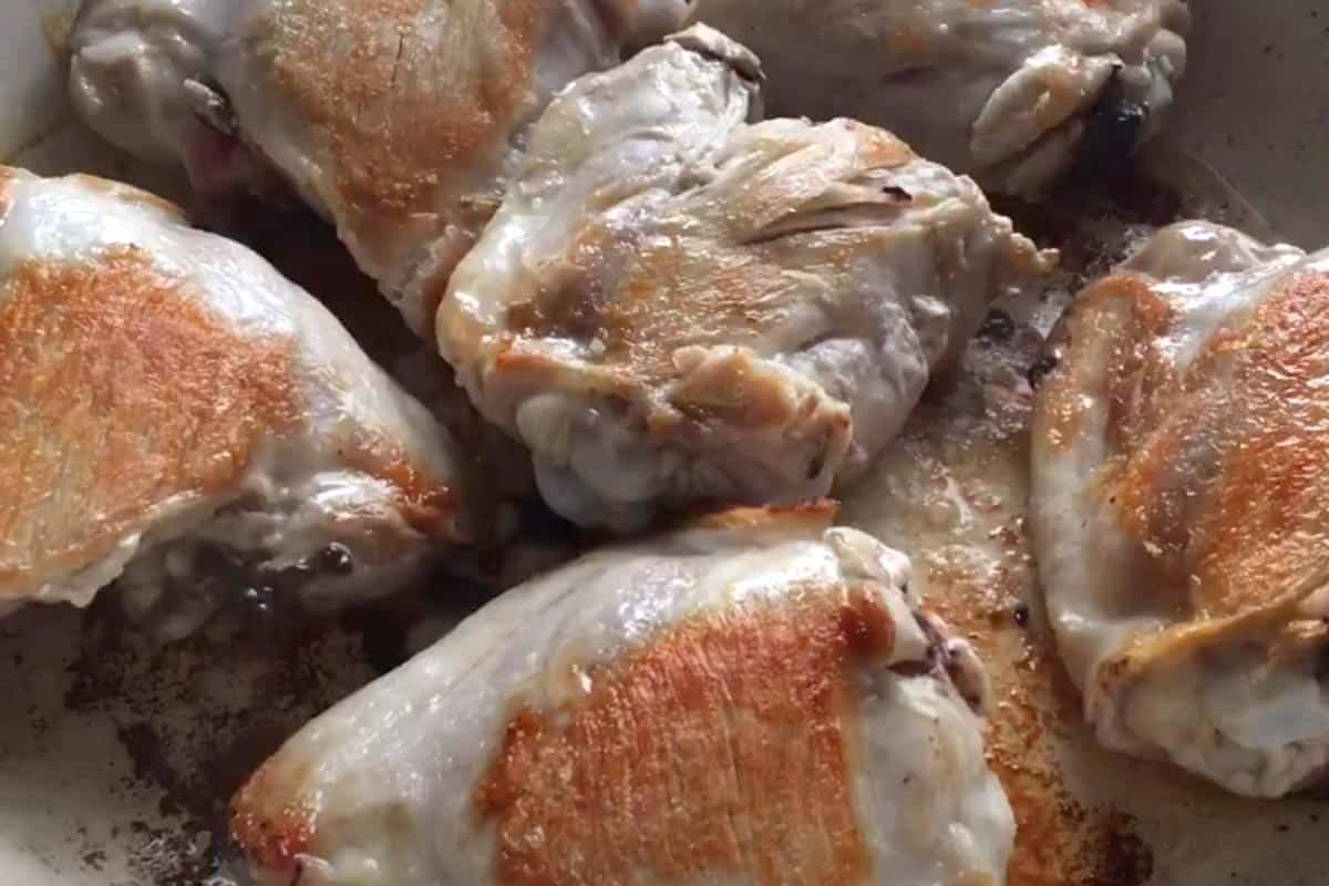 Searing the chicken.