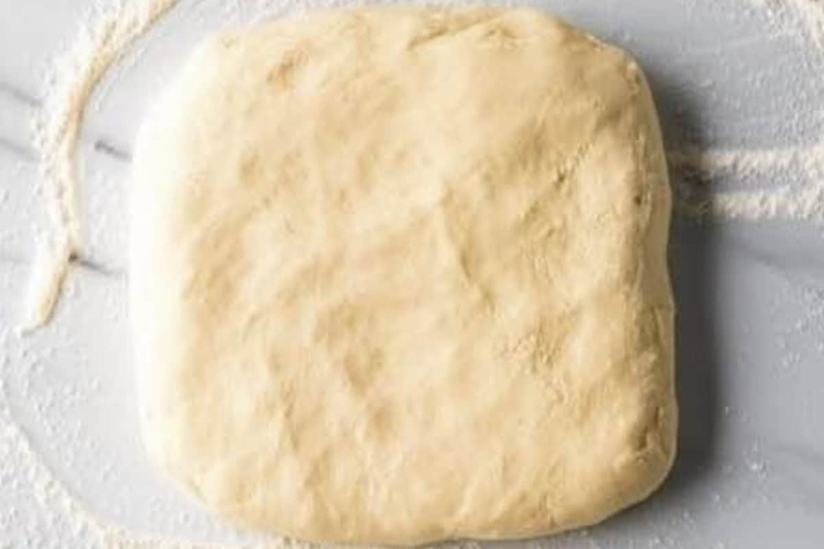 Knead the dough onto a floured surface and pat into an 8x8 inch square