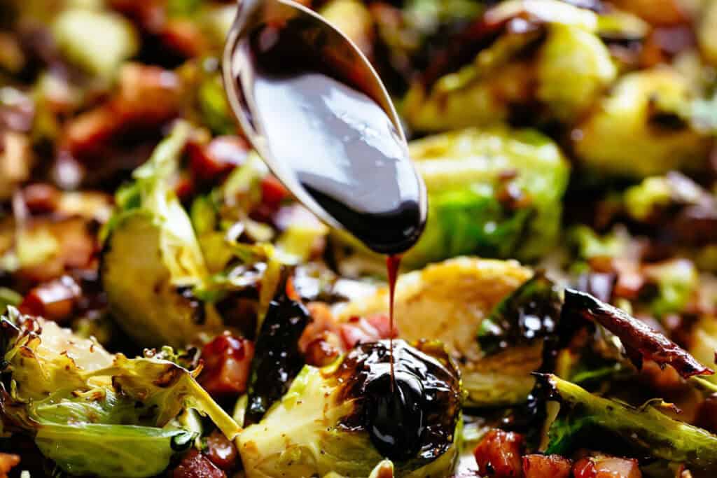 Spreading the glaze into the cooked Sprouts