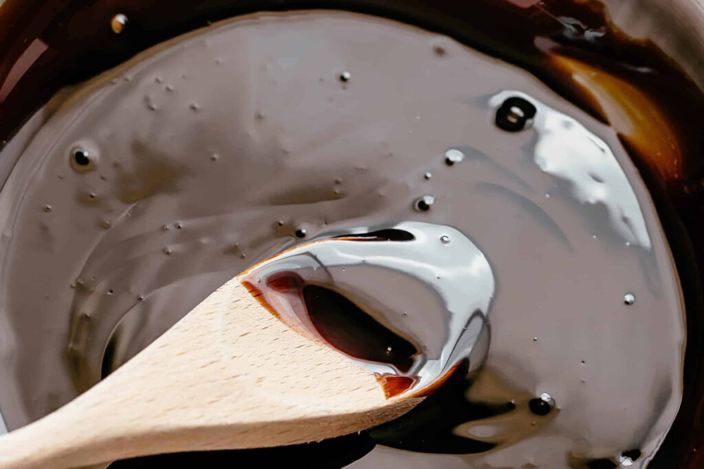Balsamic glaze with a wooden spoon