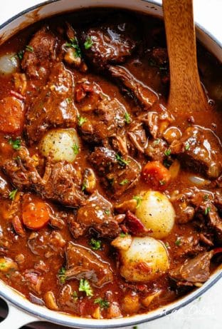 Tender fall apart chunks of beef simmered in a rich red wine gravy makes Julia Child's Beef