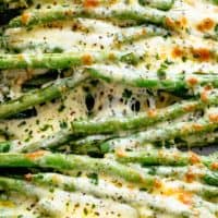 Melted cheese on roasted green beans on tray