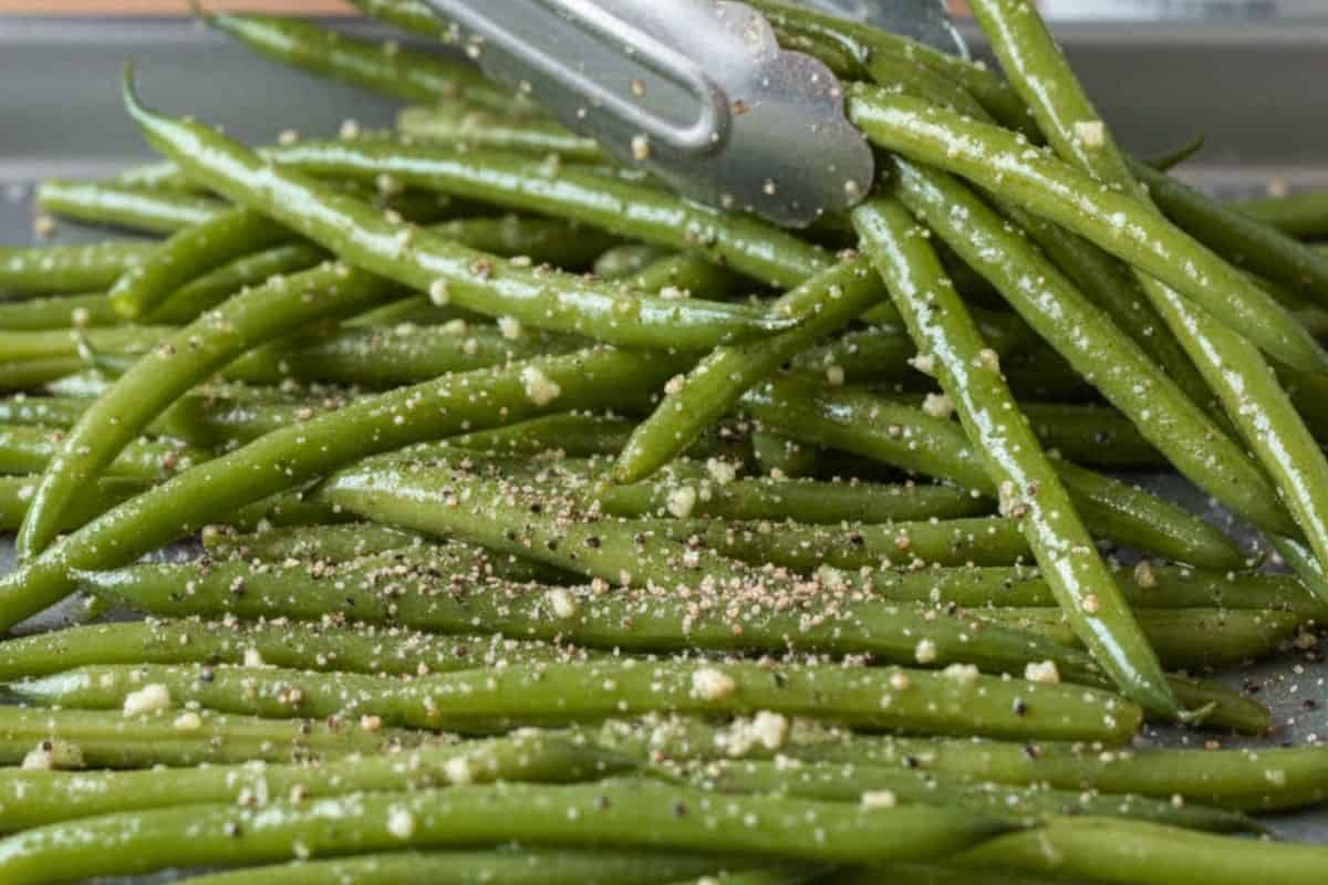 Drizzle the mixture ( olive oil, parmesan, garlic, salt and pepper) all over the beans and toss.