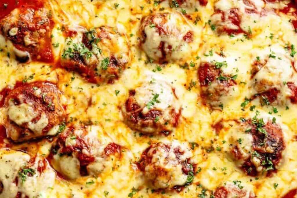  Return meatballs and any juices to the sauce, cover, and cook 20 minutes and top with mozzarella cheese. 