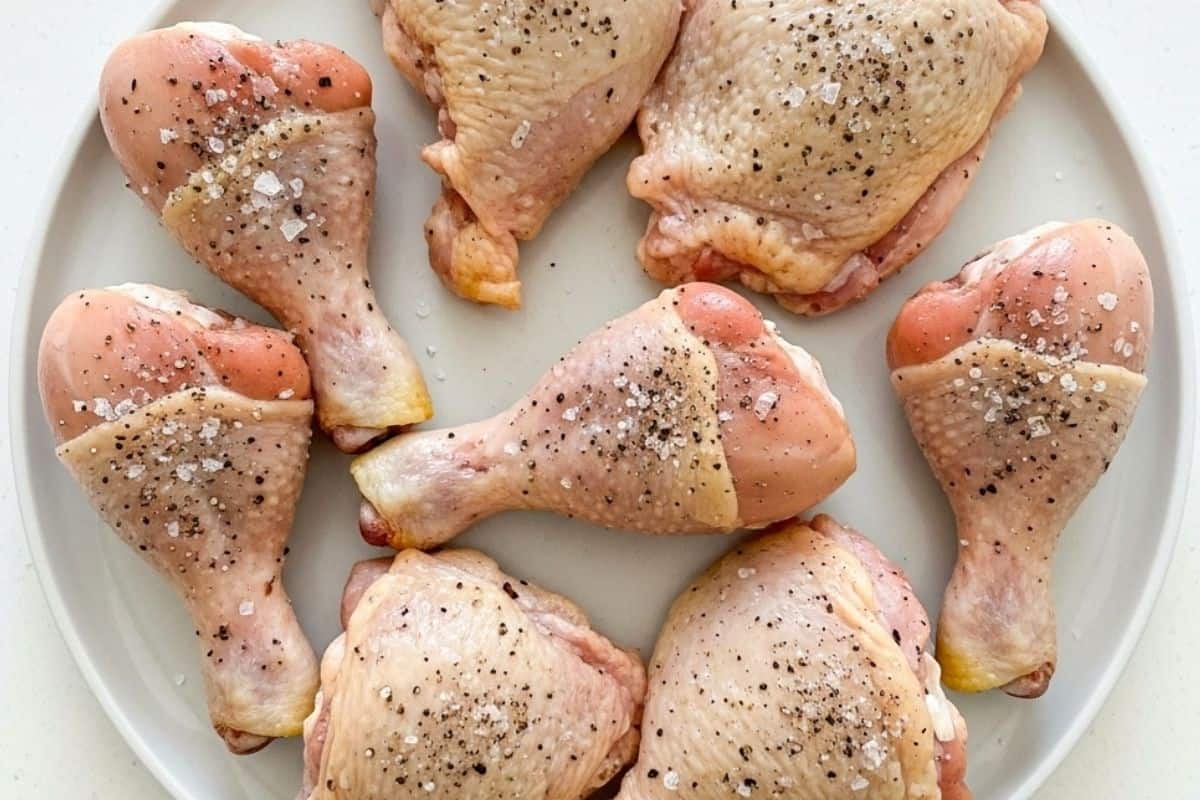 Season the chicken with pepper and salt.