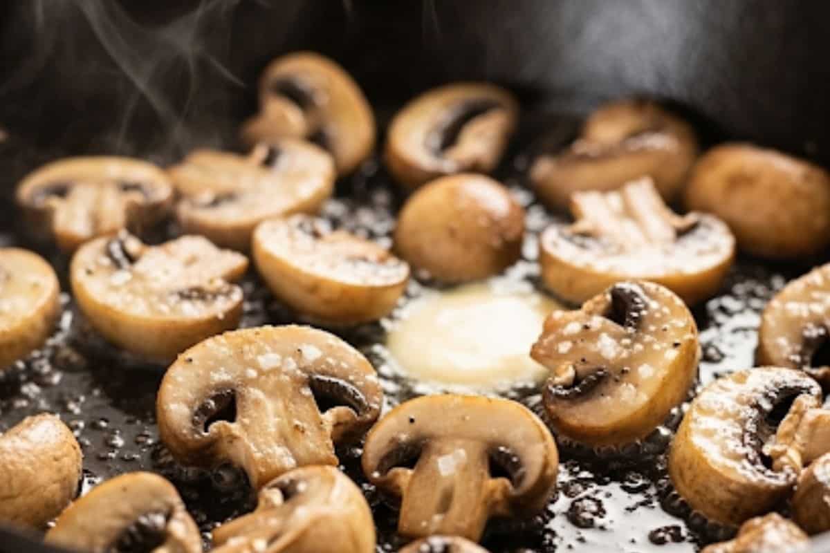 In a large skillet, melt 2 tablespoon of butter and add the mushrooms until golden brown.