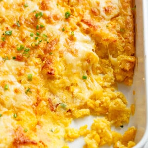 Corn casserole in casserole dish with cheese
