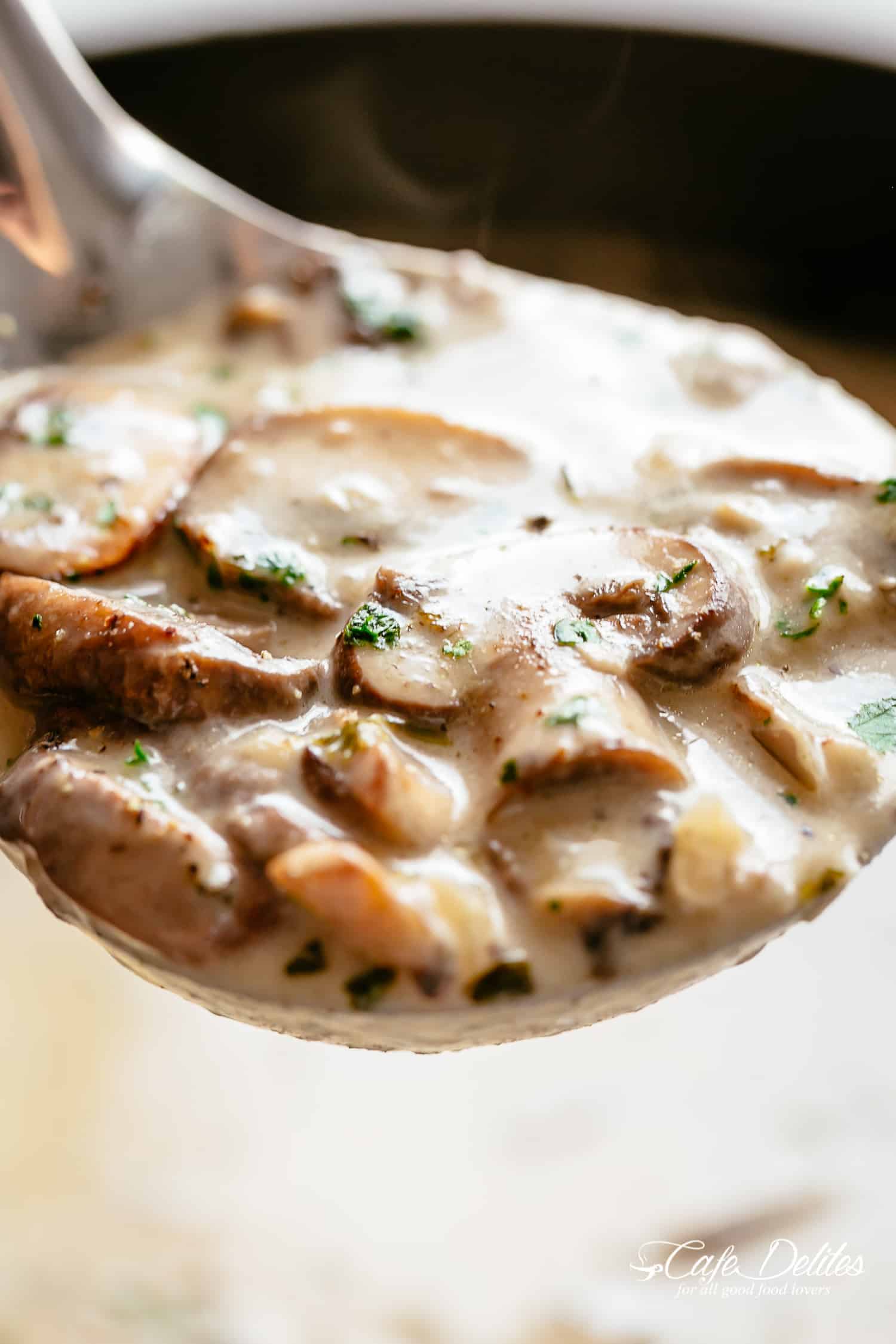 Homemade Creamy Mushroom Soup on a ladle | cafedelites.com