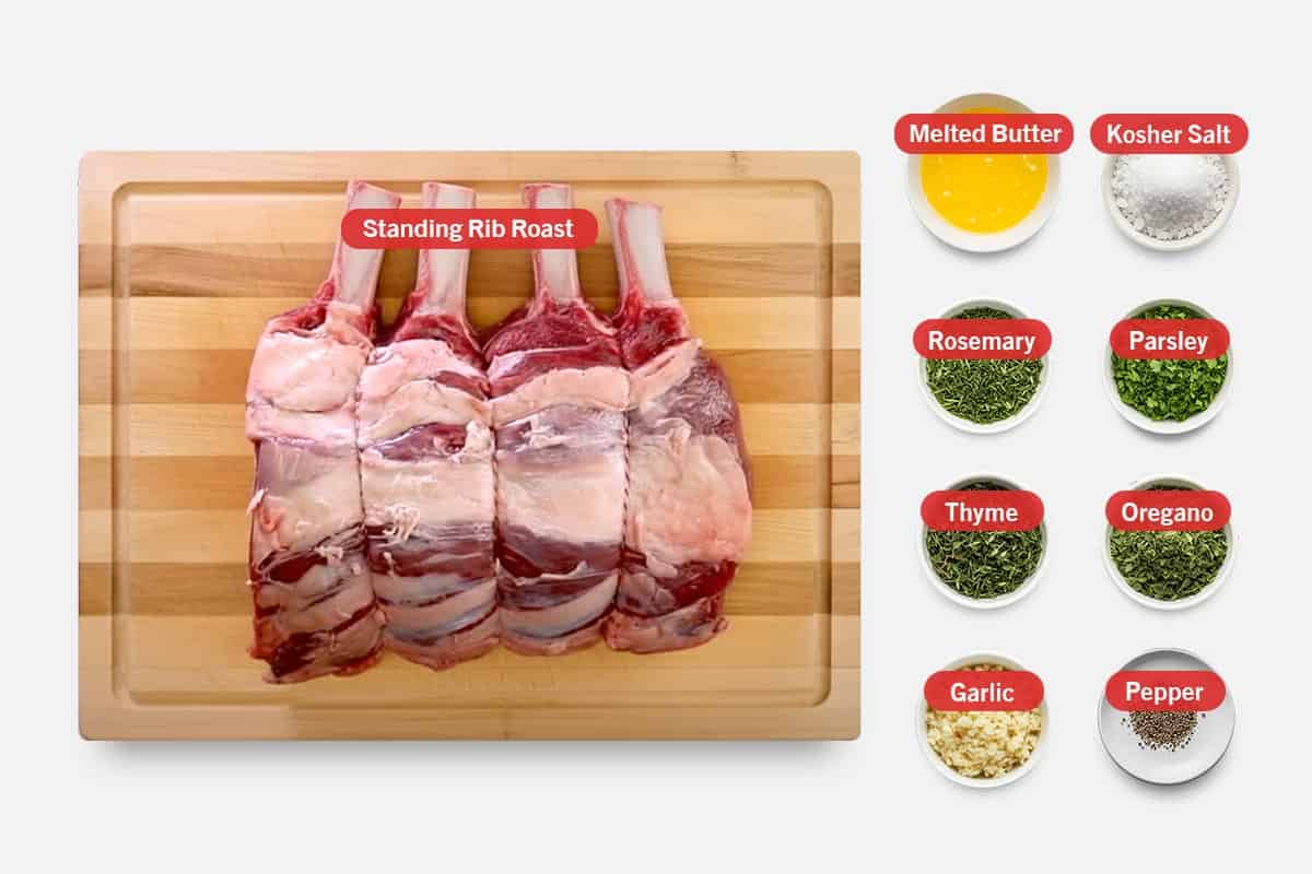 Top shot of ingredients: Standing rib roast, melted butter, kosher salt, rosemary, parsley, thyme, oregano, garlic, and pepper.