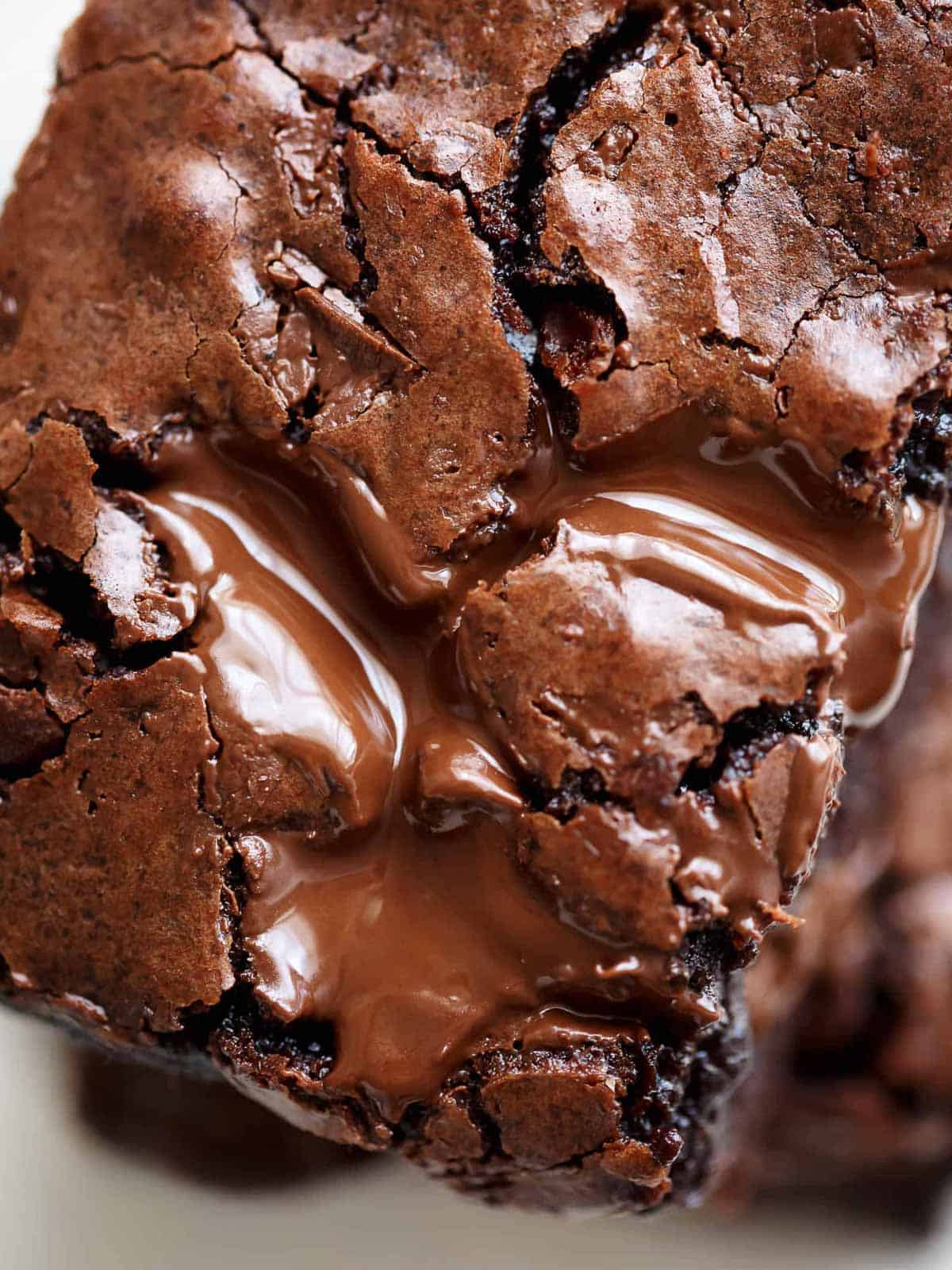 Close-up image of freshly baked brownies just taken out of the oven with gooey, melting chocolate chunks