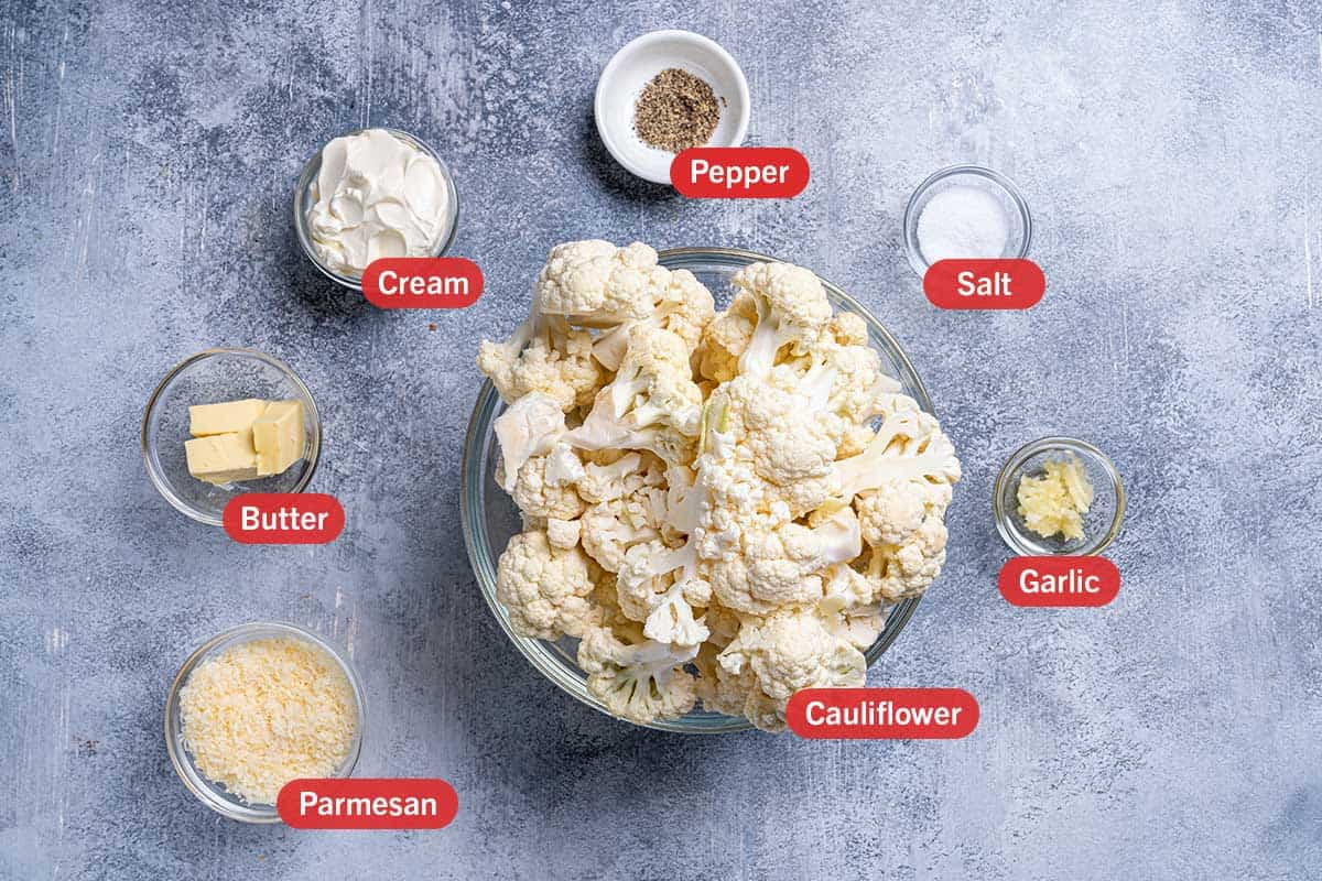 Image of the ingredients needed for the preparation of the dish, specifically: cauliflower, parmesan, butter, cream, pepper, salt, and garlic.