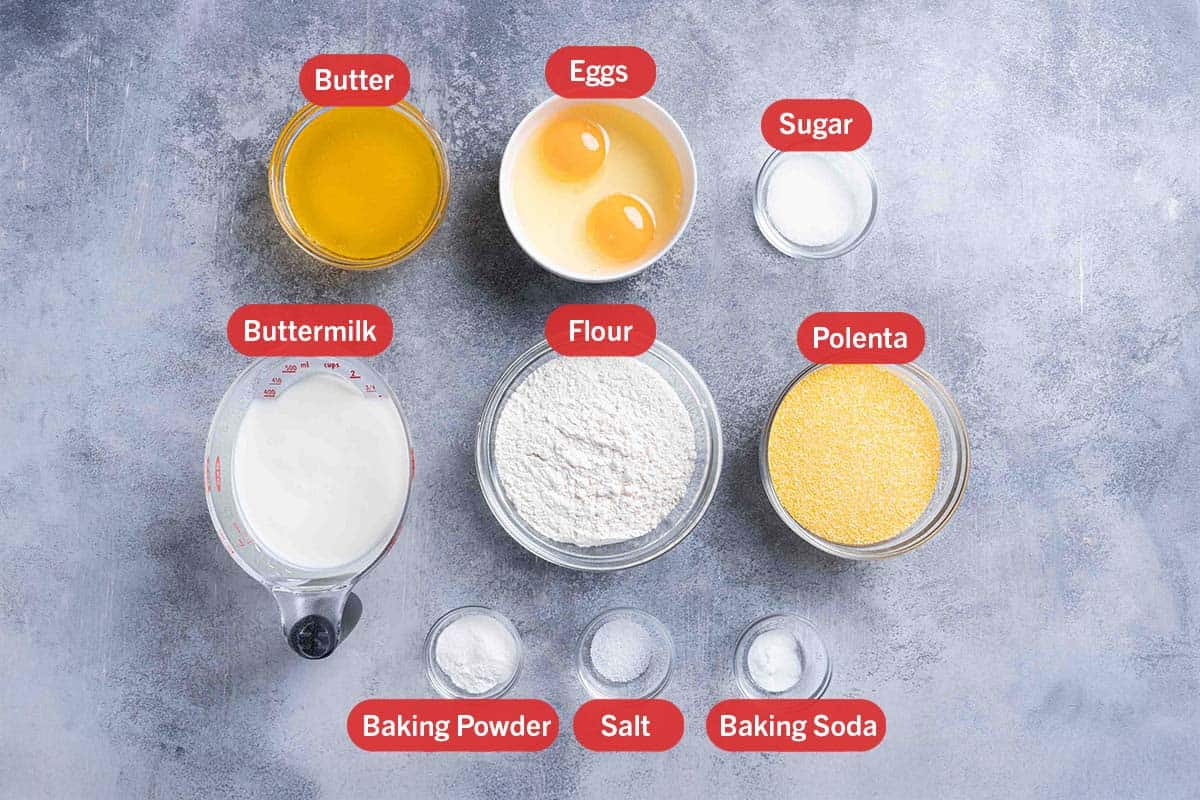 A picture of the ingredients needed for the cornbread recipe, specifically: butter, eggs, sugar, buttermilk, flour, polenta, baking powder, salt, and baking soda.