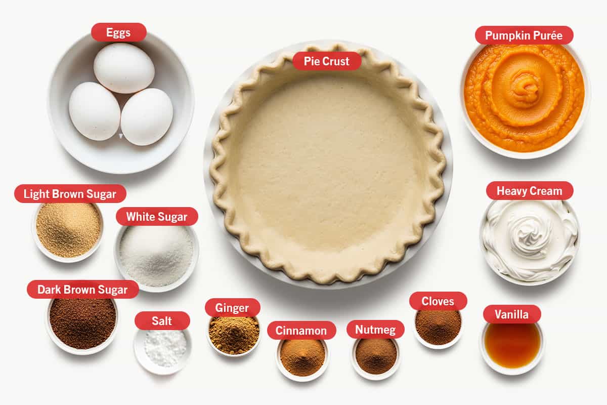 Ingredients shot: pumpkin purée, heavy cream, pie crust, eggs, light brown sugar, white sugar, dark brown sugar, salt, ground ginger, ground cinnamon, ground nutmeg, ground cloves, and vanilla.
