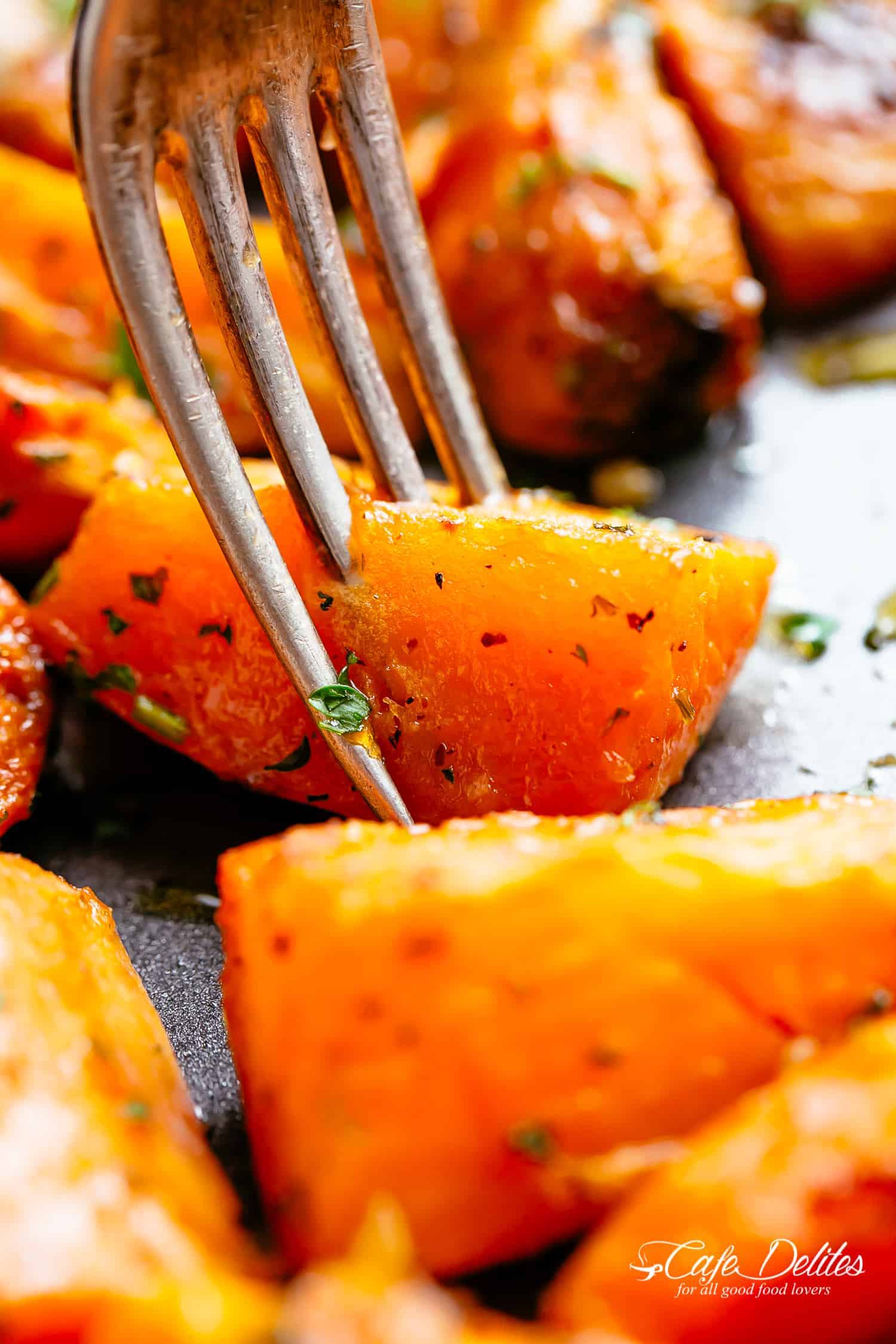 roasted potato being hold with a fork