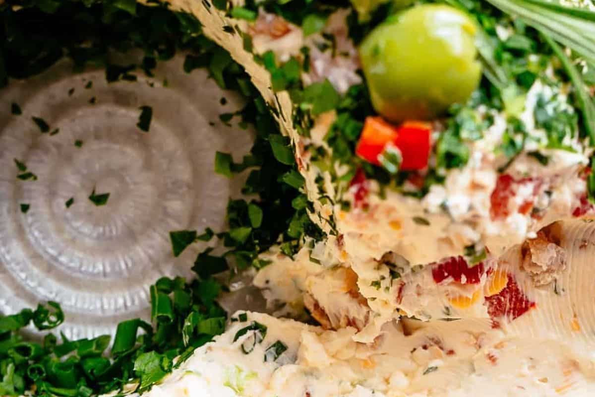 Present your beautiful cheese wreath and serve it with crackers, pretzels, or cold cuts.