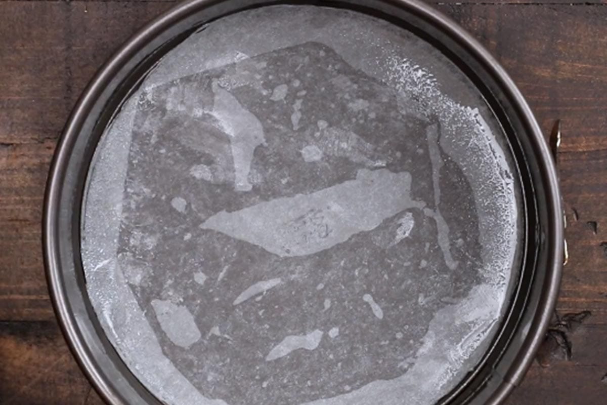 Lightly greased a round cake pan with non stick spray and lined the base with parchment paper.