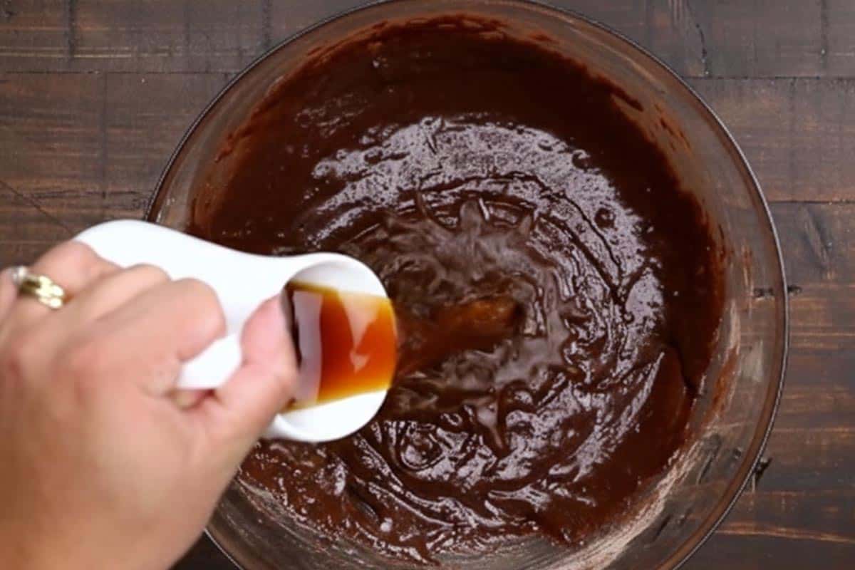 Pouring the coffee in the mixture.