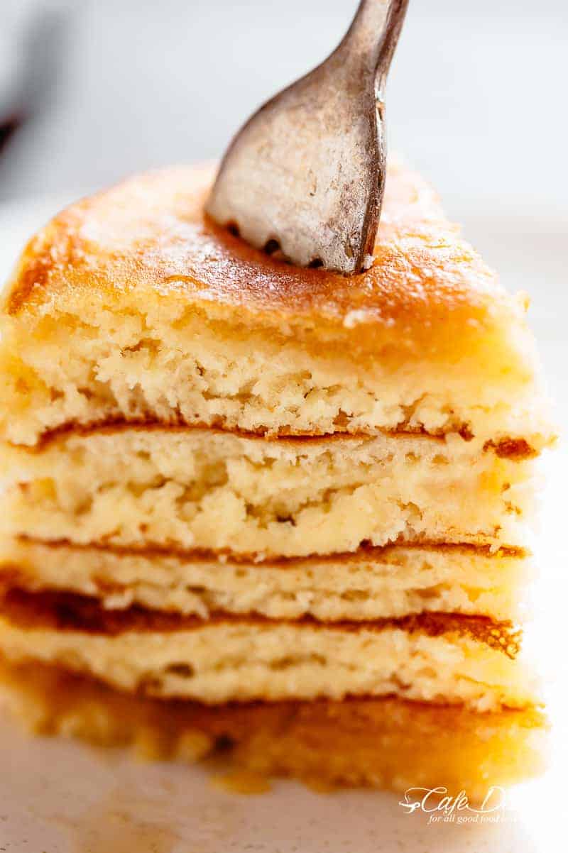 A slice of Buttermilk Pancakes are deliciously buttery and fluffy with golden, crisp edges and an irresistible buttermilk flavour! | cafedelites.com
