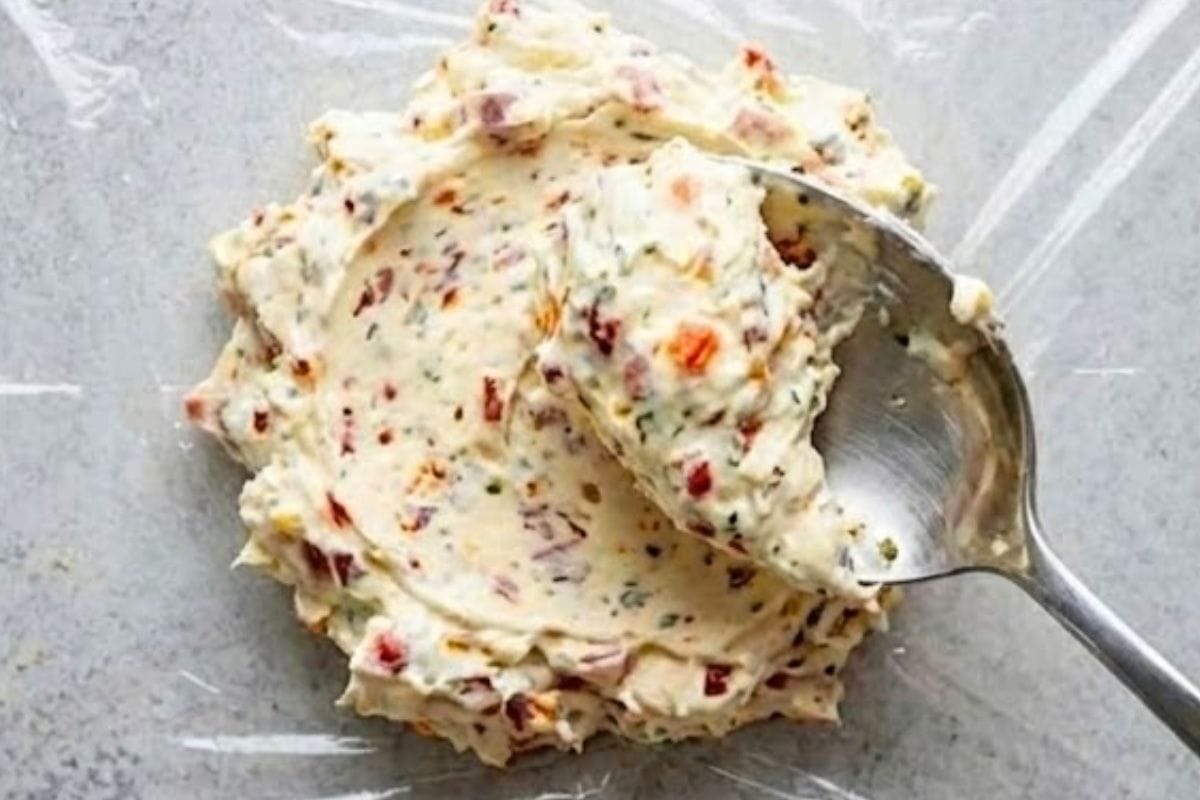 Lay non-stick plastic wrap on a clean surface. Spoon cream cheese onto the center and cover with another sheet of plastic wrap - 4