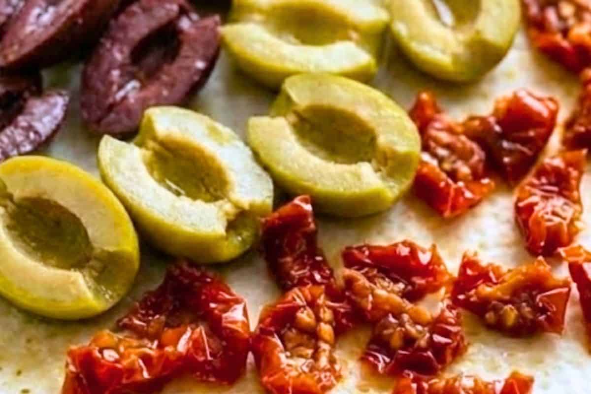 Pat the olives and sun-dried tomatoes dry with paper towel to remove excess oil - 6