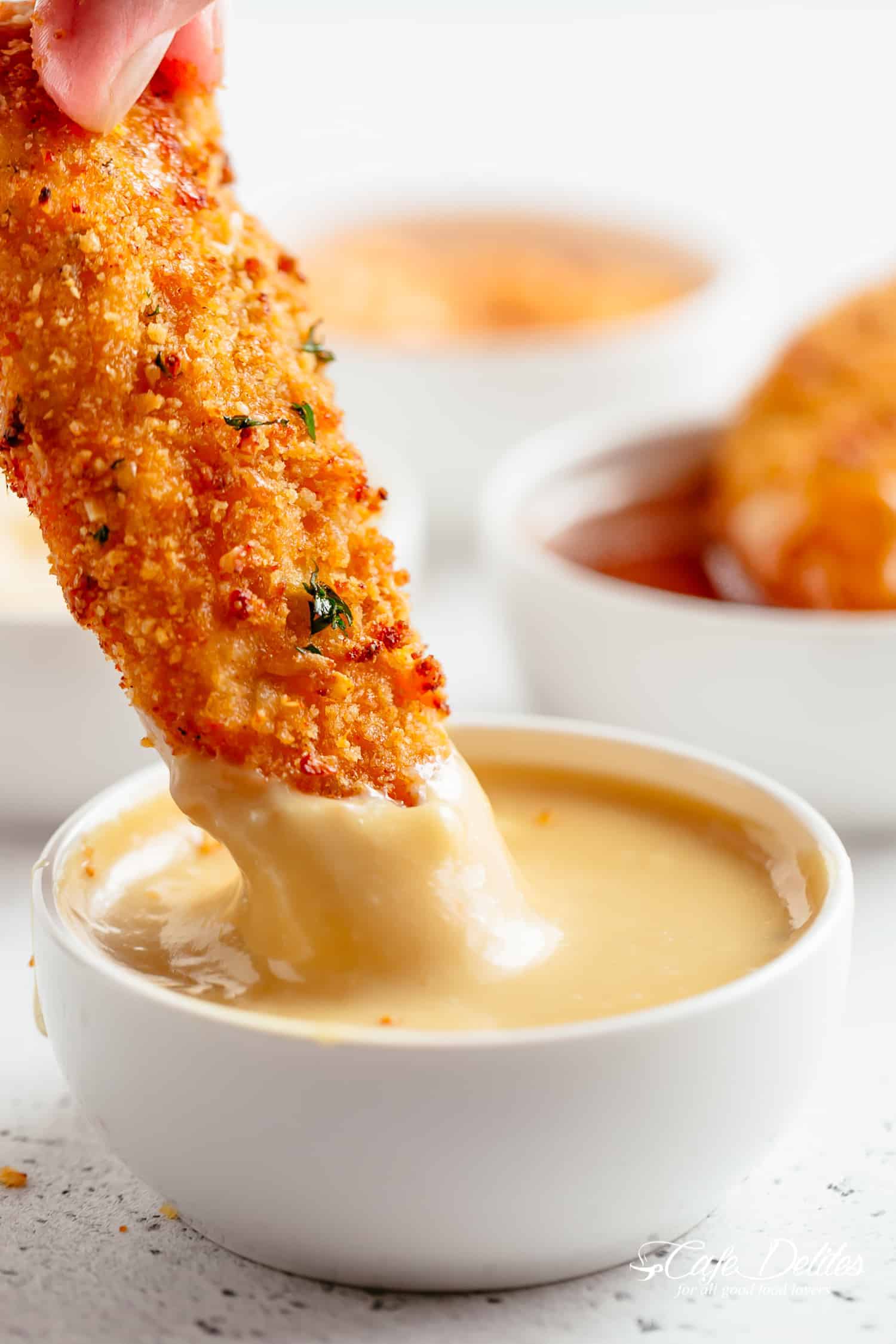 Chicken Tenders dipped in honey mustard sauce. | cafedelites.com