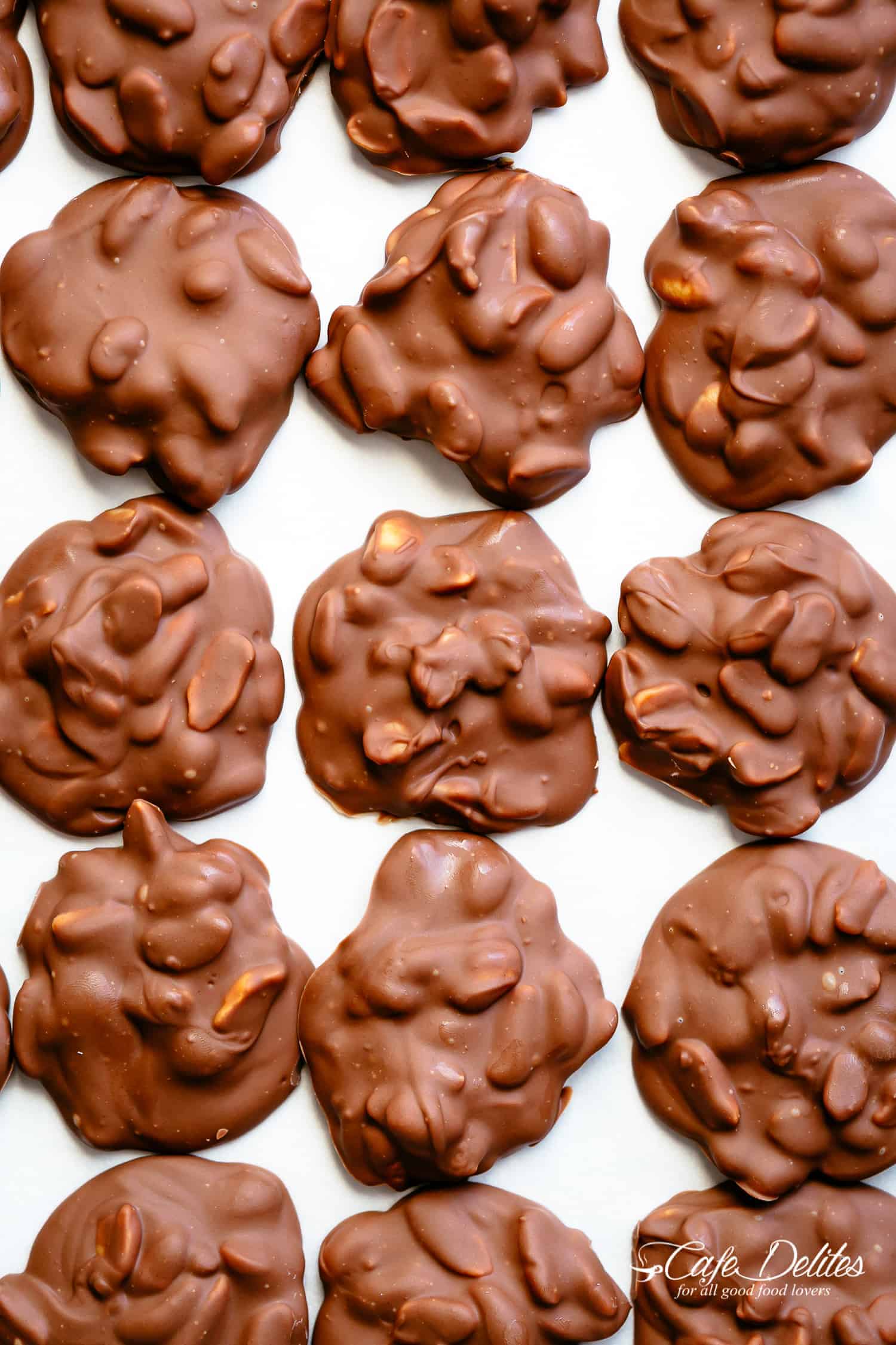 Chocolate Peanut Clusters on a baking sheet | cafedelites.com