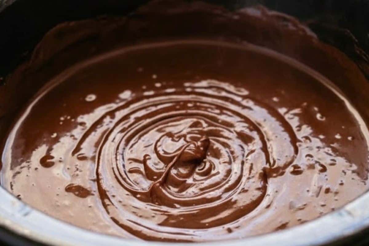 Spray a 6 quart slow cooker with nonstick spray. Add ingredients, cover, and cook on low for 1 to 2 hours