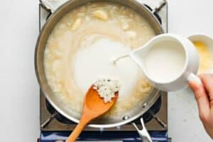 Pour in the cream and let this simmer for a few minutes. Now mix in the Parmesan cheese