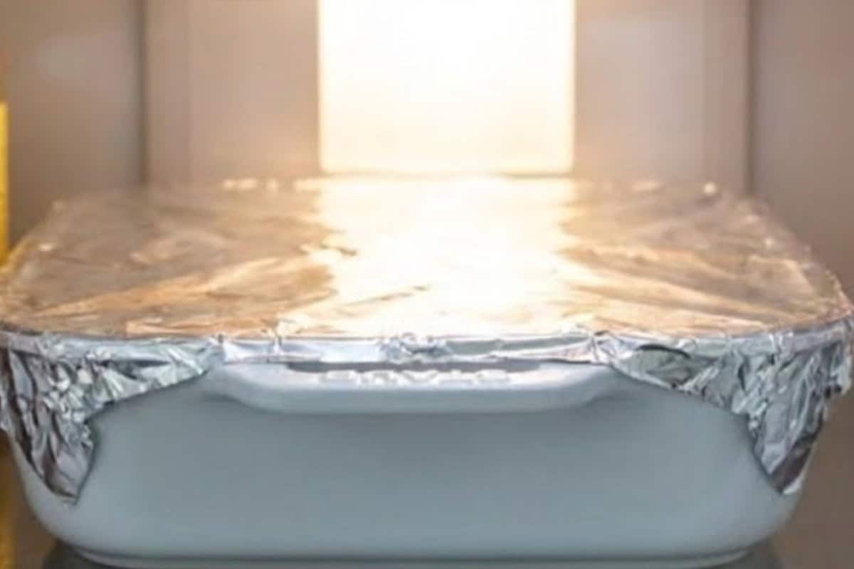 Add remaining bread, pour over remaining custard, top with spiced sugar, press gently, then cover and refrigerate.