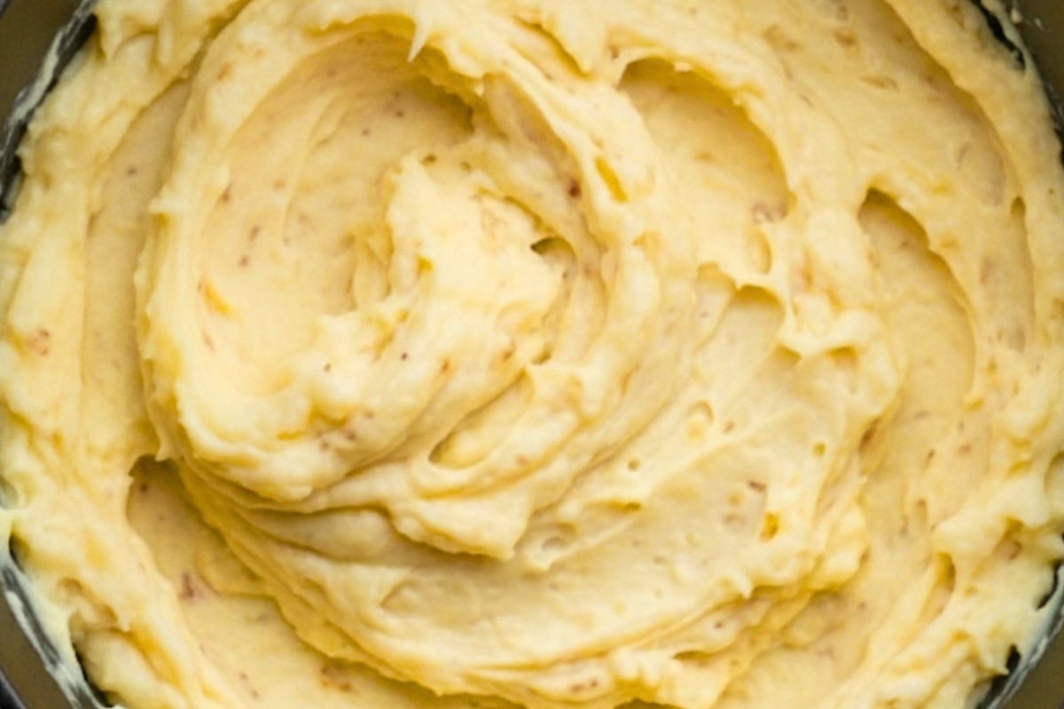 Strain half of the brown butter over the potatoes, add parmesan cheese and milk and mash until smooth and creamy.