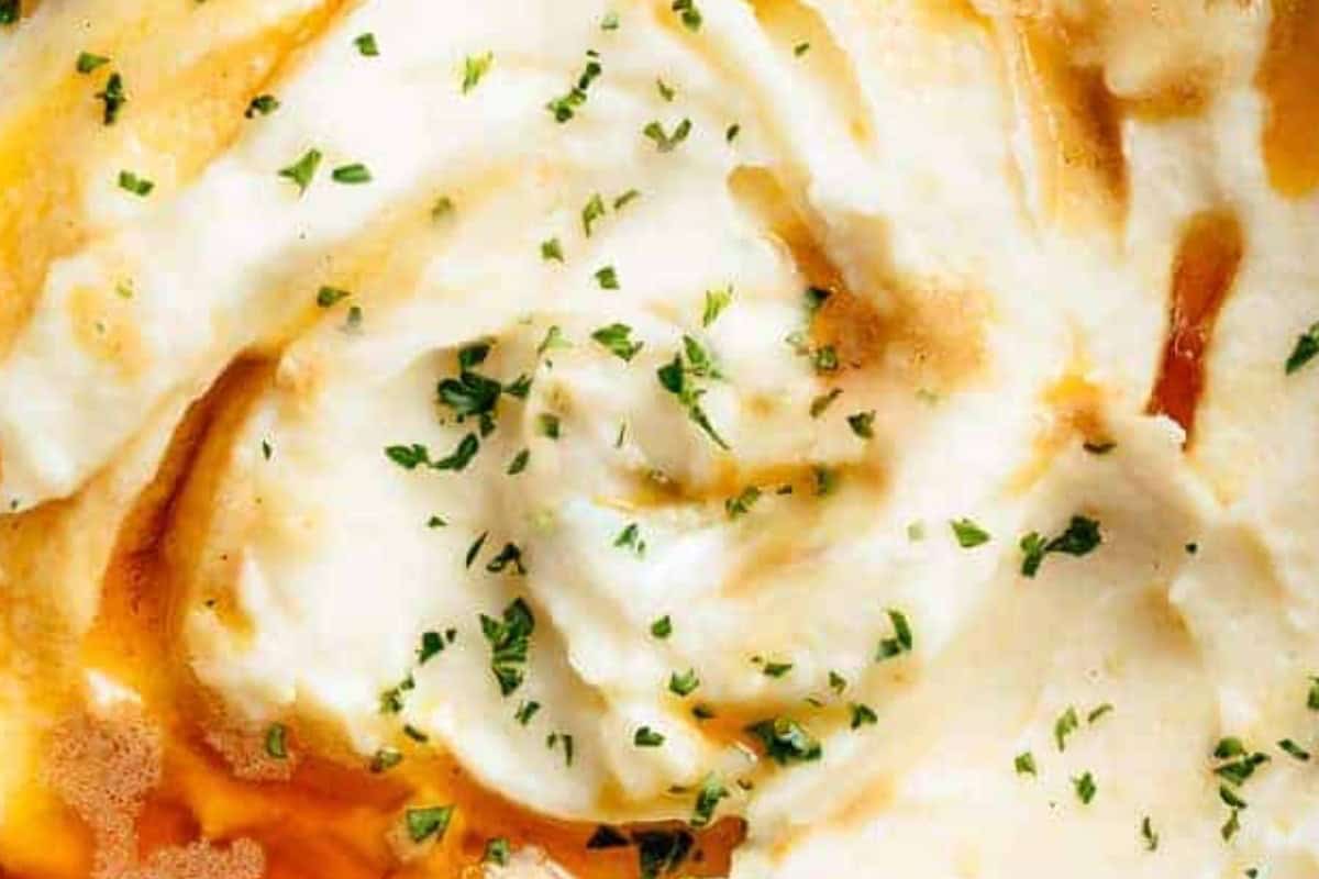 Drizzle the remaining brown butter and top with parmesan, chopped parsley and crispy garlic pieces.