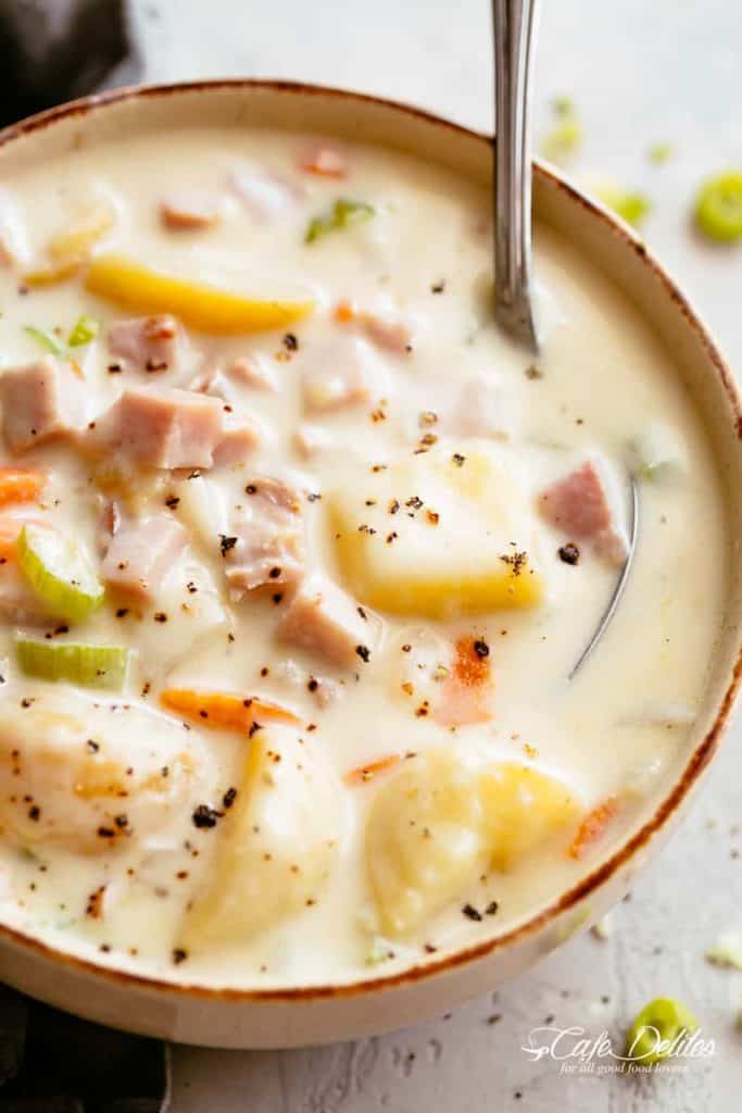 Deliciously creamy Ham and Potato Soup is easy to make and perfect to use up any leftovers! Filled with soft, tender potatoes, carrots, celery, onion, garlic and the option of making your own ham broth from a leftover ham bone! The best part? No heavy cream! Picky eaters will ask for seconds! | cafedelites.com