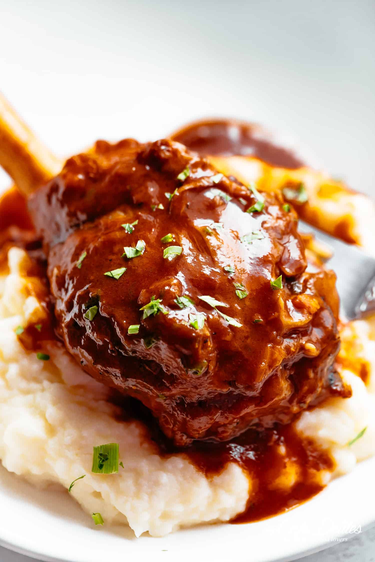 Tender Lamb Shank served with mashed potatoes | cafedelites.com