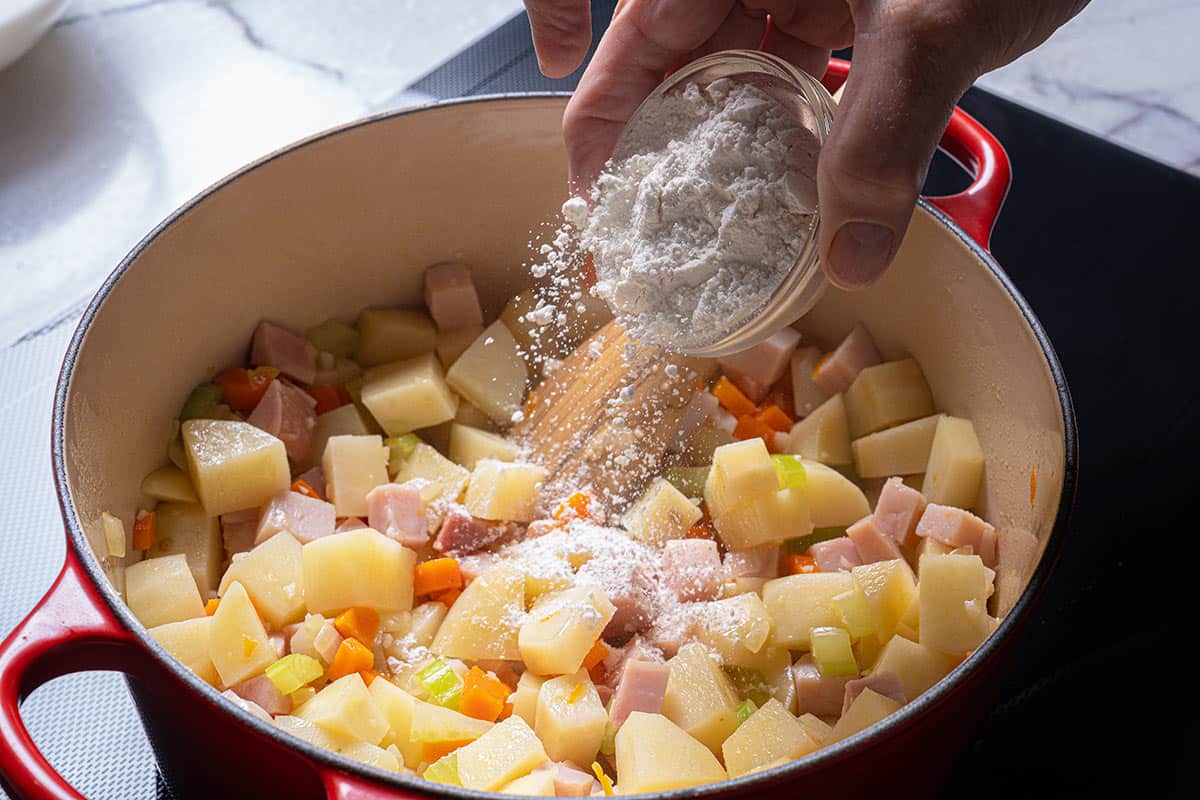 Image of flour being added to the mix and cooked.