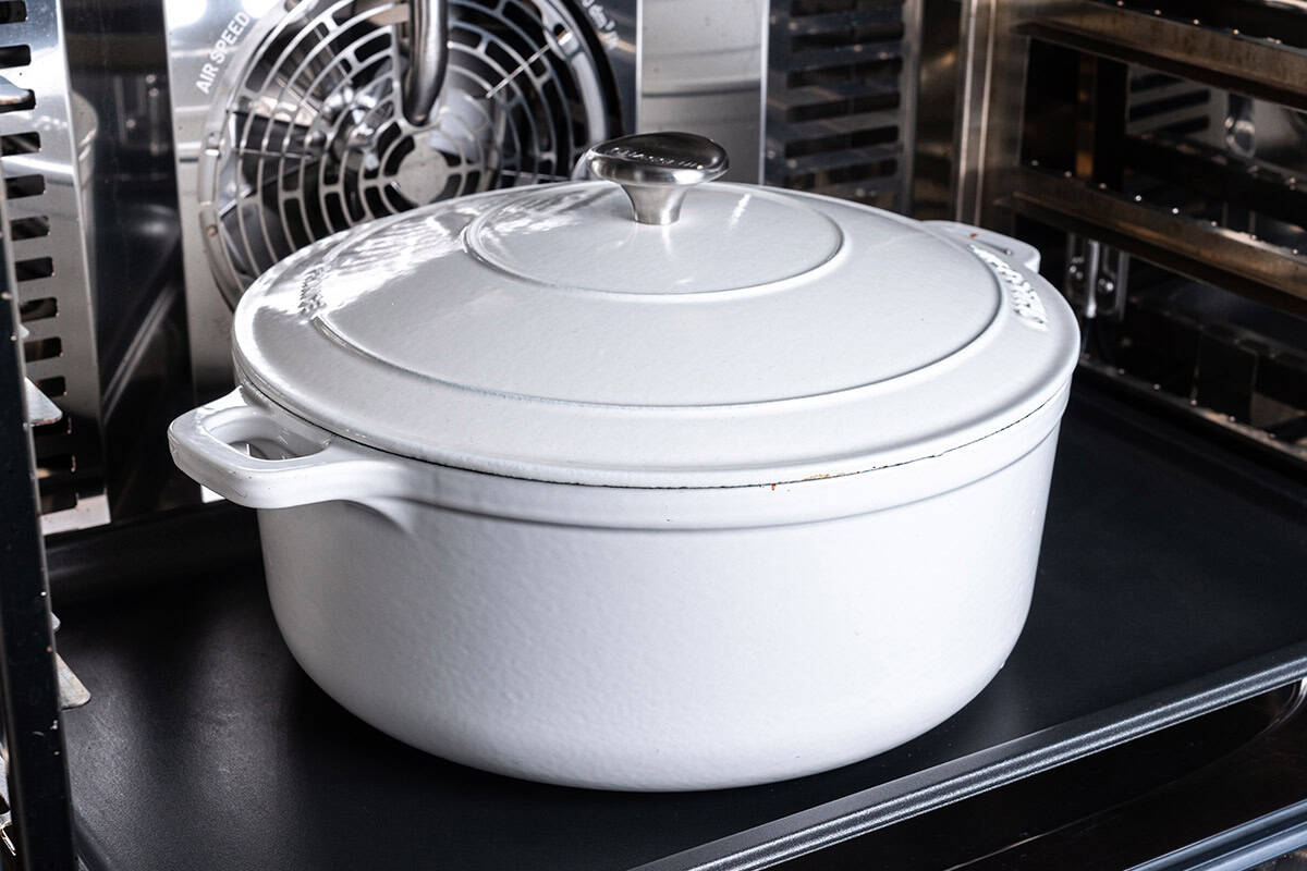 a blue pot inside an oven