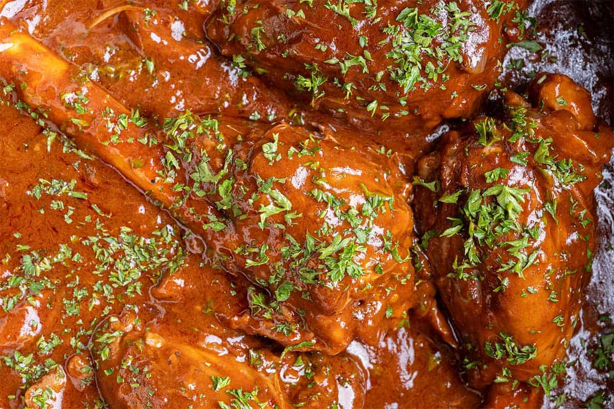 a close up shot of Braised Lamb Shanks