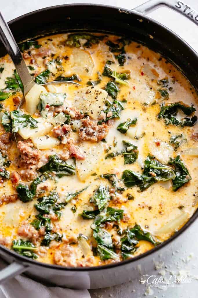 Creamy Zuppa Toscana full of crumbled sausage, crispy bacon and tender potatoes in a creamy broth!